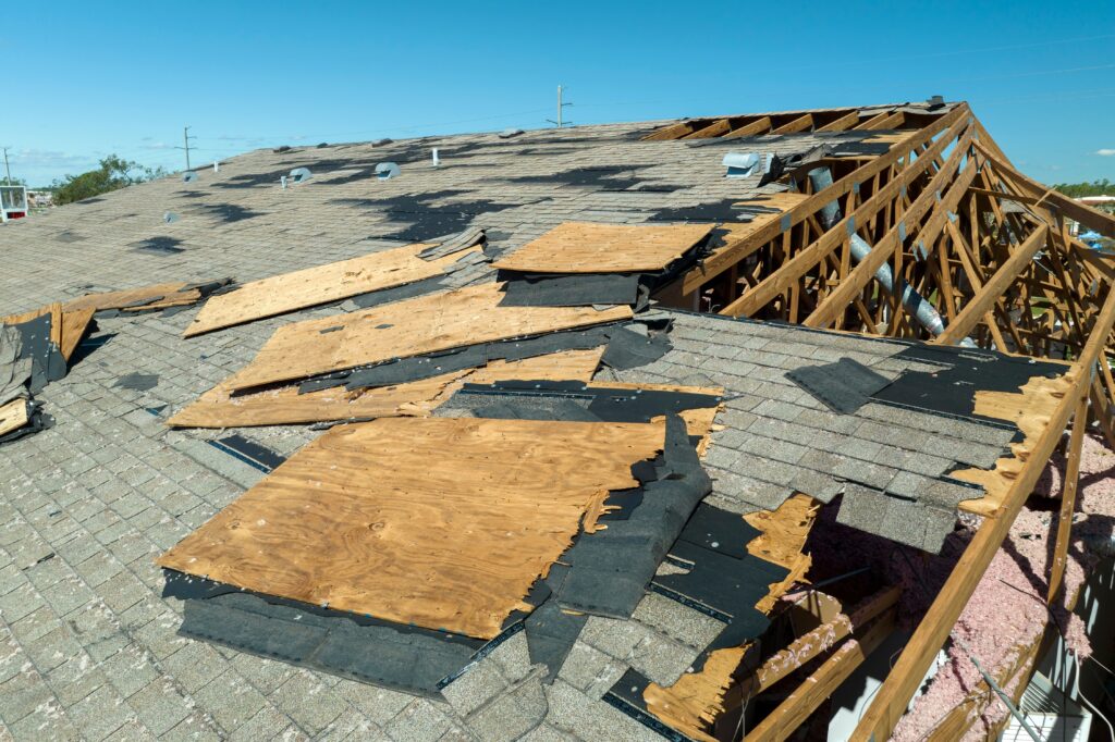 Damaged roof with missing shingles in Colorado